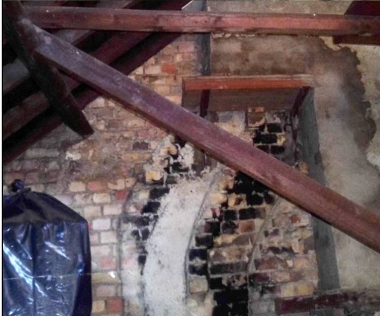 Open-plan room showing structural alterations and steel beam