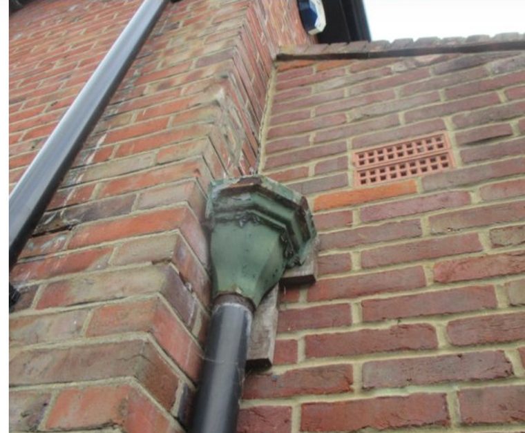 Blocked and overflowing external guttering