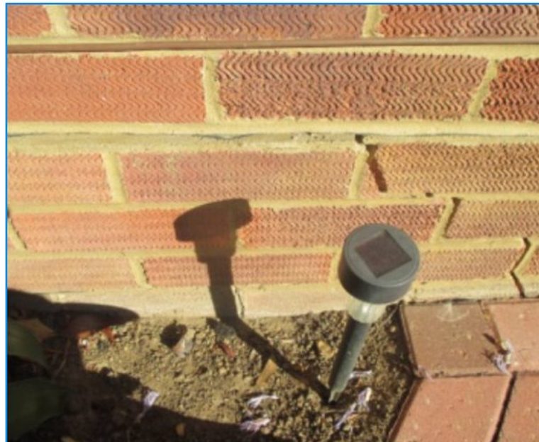 Cracked external brickwork showing signs of structural movement